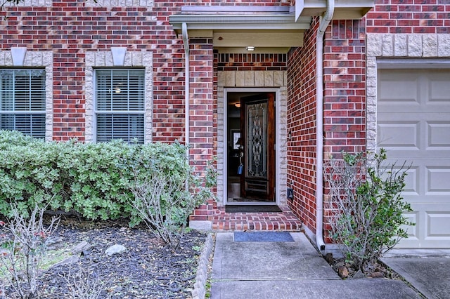 view of exterior entry featuring a garage