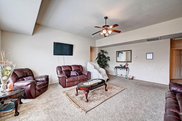 carpeted living room featuring ceiling fan