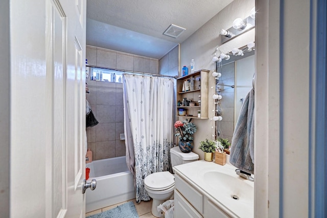 full bathroom with vanity, shower / tub combo, toilet, tile patterned floors, and a textured ceiling