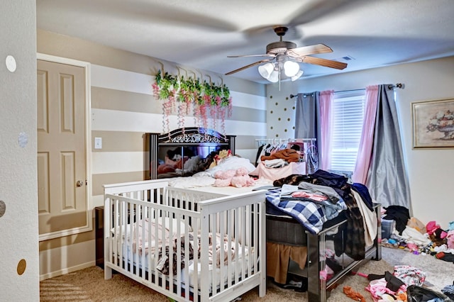 carpeted bedroom featuring ceiling fan