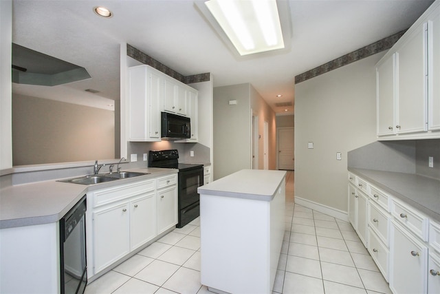 kitchen with white cabinetry, sink, black appliances, and a kitchen island