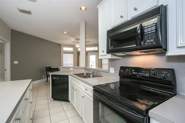 kitchen featuring sink, light tile patterned floors, ceiling fan, white cabinetry, and black appliances