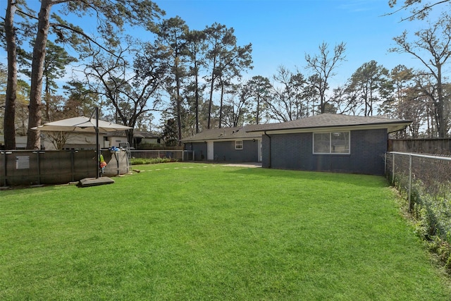 view of yard featuring a fenced backyard