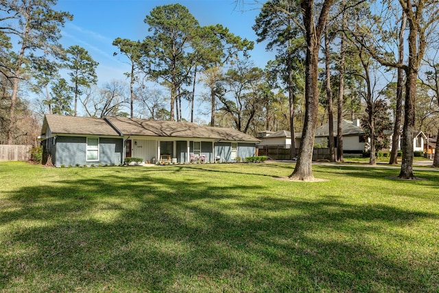 exterior space with a yard and fence