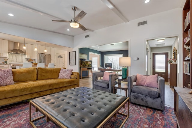 living area with visible vents and a wealth of natural light