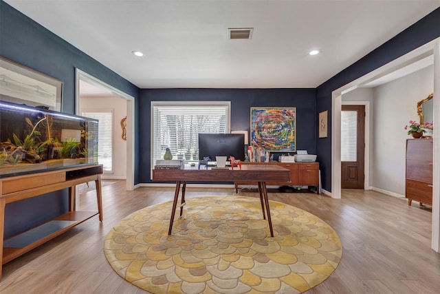 office featuring baseboards, visible vents, wood finished floors, and recessed lighting