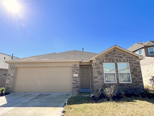 ranch-style home with a garage and a front lawn