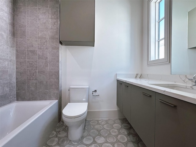 full bathroom featuring tiled shower / bath combo, vanity, tile patterned floors, and toilet