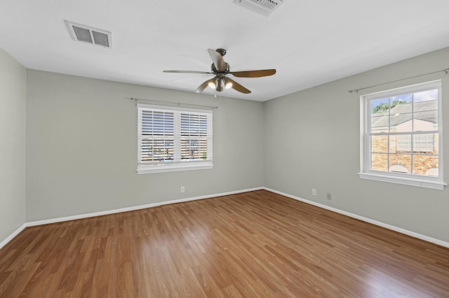 unfurnished room featuring hardwood / wood-style floors and ceiling fan