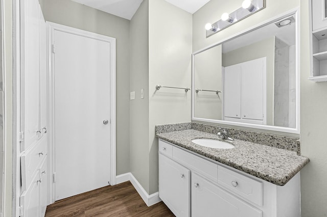 bathroom featuring vanity and hardwood / wood-style floors