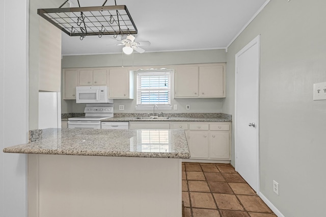 kitchen featuring white appliances, sink, and white cabinets