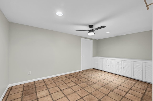 unfurnished room with ceiling fan