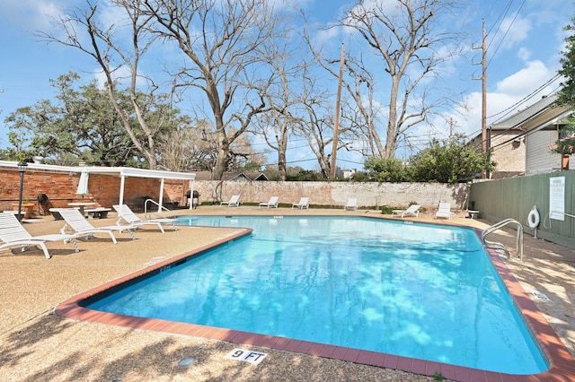 view of swimming pool featuring a patio area