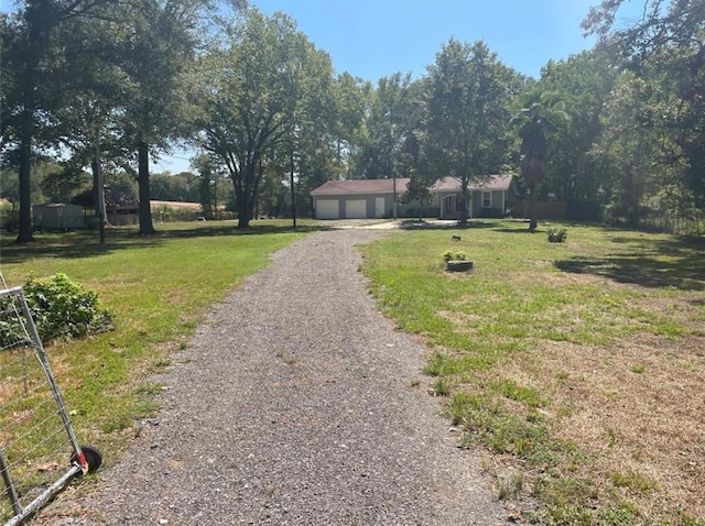 view of front facade featuring a garage and a front lawn