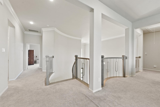 hallway with light carpet and crown molding