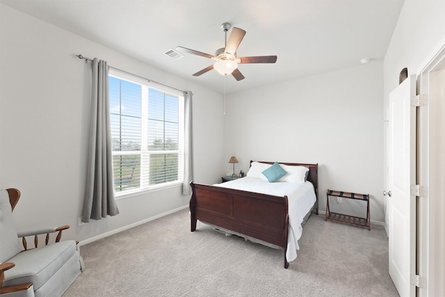 bedroom with light colored carpet and ceiling fan