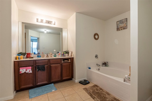 bathroom with vanity, a bath, and tile patterned floors