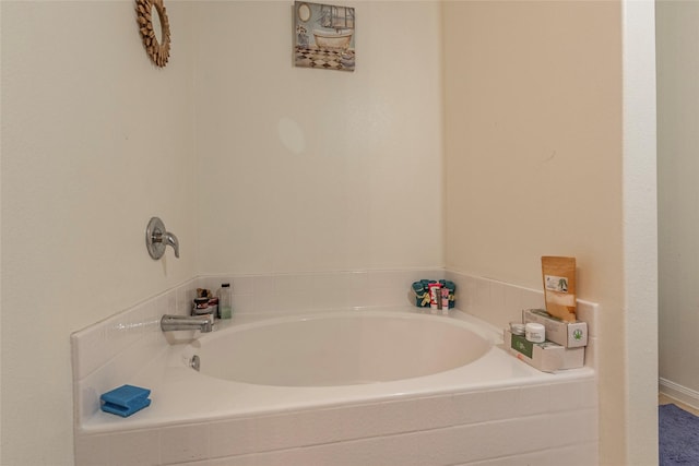 bathroom with tiled bath