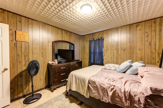 bedroom with wooden walls