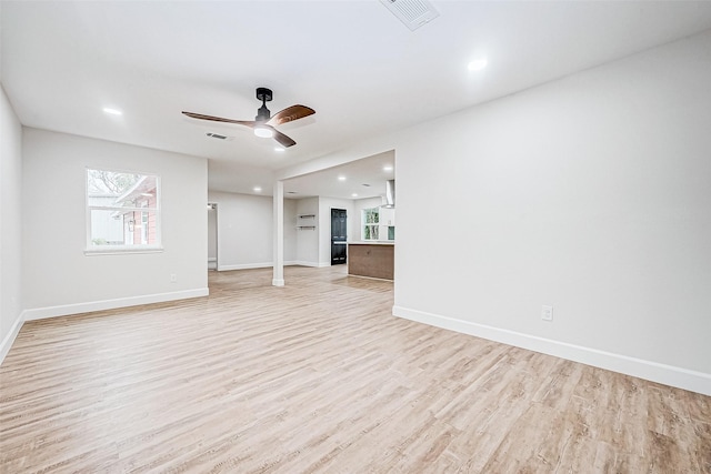 unfurnished living room with light hardwood / wood-style floors and ceiling fan