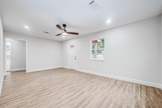 unfurnished room with light hardwood / wood-style flooring and ceiling fan