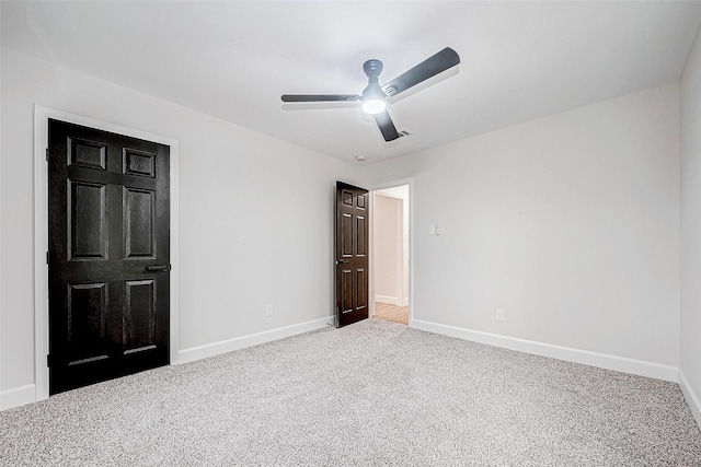 unfurnished bedroom featuring carpet flooring and ceiling fan