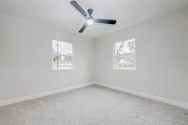 empty room featuring ceiling fan and carpet flooring