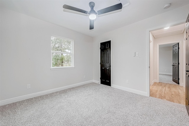 unfurnished bedroom with ceiling fan and light carpet