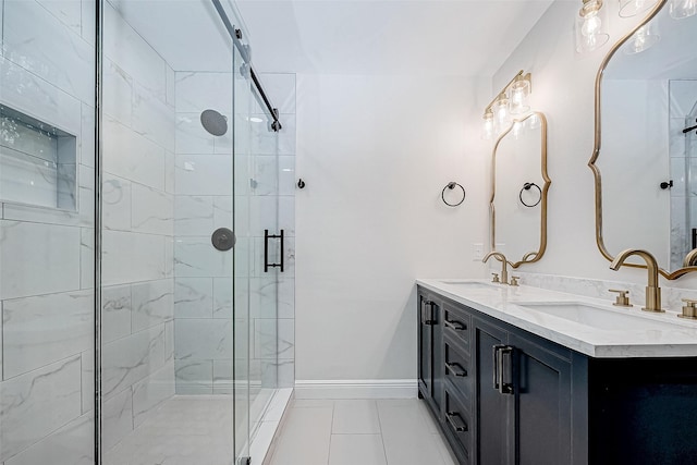 bathroom with vanity and a shower with door