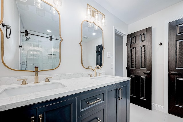 bathroom featuring a shower with door, vanity, and tile patterned floors