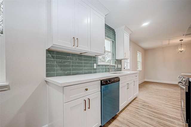 kitchen with white cabinetry, dishwasher, sink, and electric range