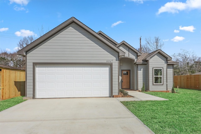 single story home with a garage and a front yard