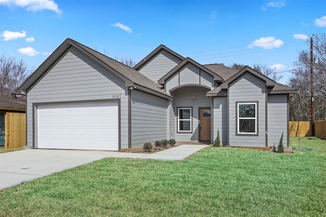 view of front of house with a garage and a front yard