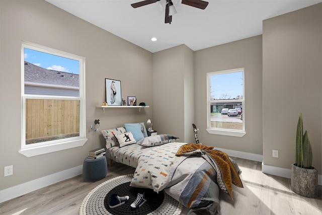 bedroom featuring ceiling fan and light wood-type flooring
