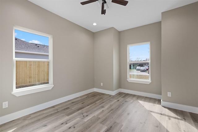 unfurnished room featuring ceiling fan and light wood-type flooring