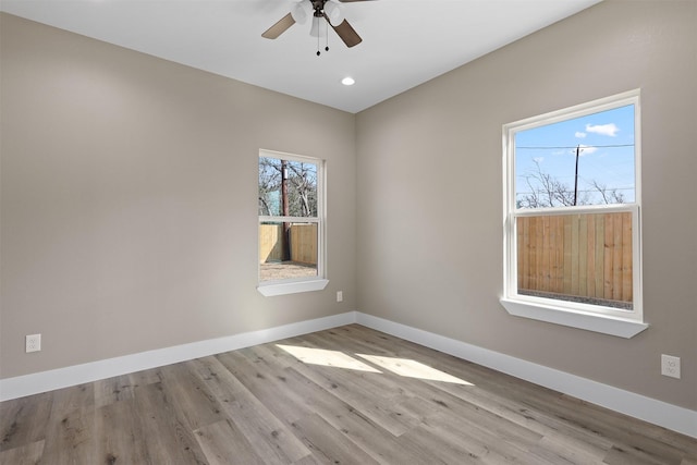 empty room featuring light hardwood / wood-style floors and ceiling fan
