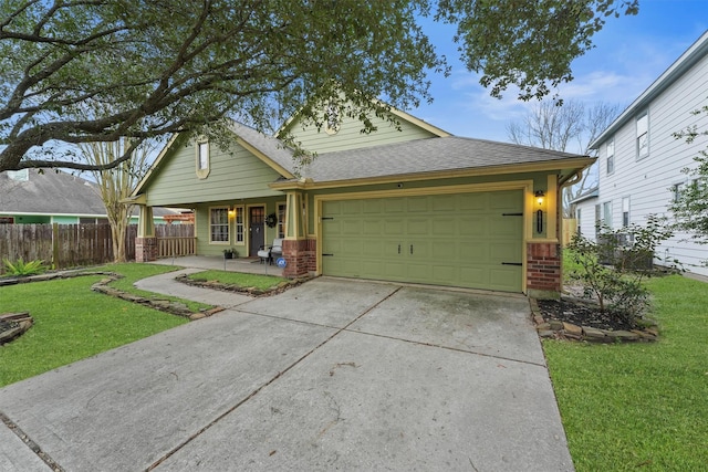 view of front facade with a porch, a garage, and a front lawn