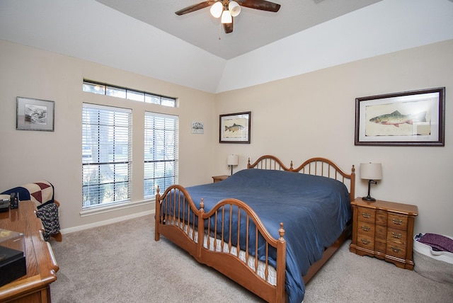 carpeted bedroom with ceiling fan and lofted ceiling