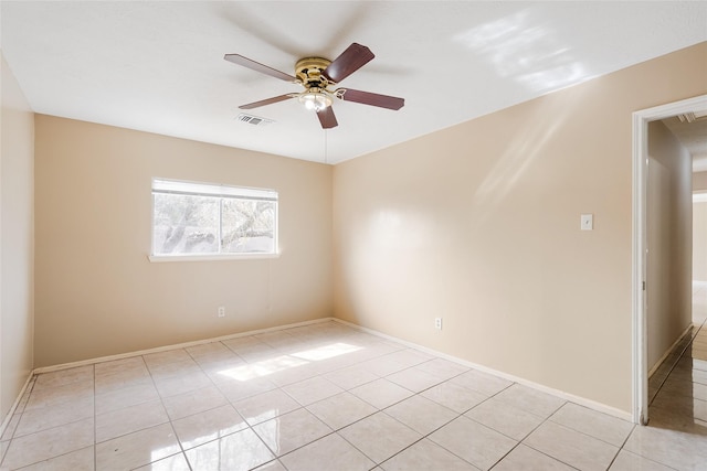 unfurnished room featuring ceiling fan and light tile patterned floors