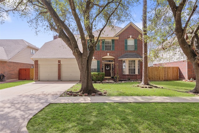 view of front of house featuring brick siding, an attached garage, fence, driveway, and a front lawn