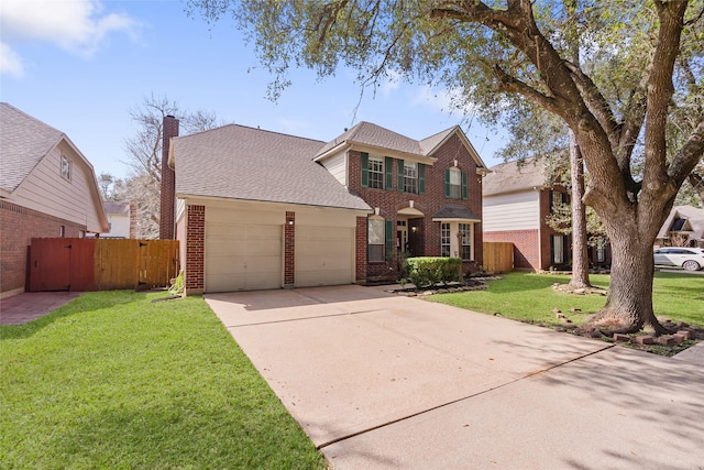 front of property with a front lawn and a garage