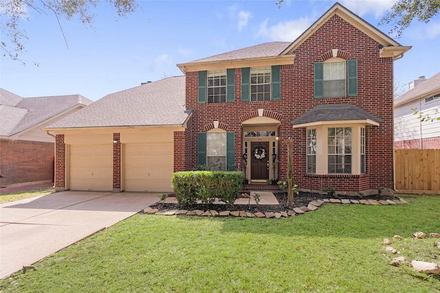 view of front of property with a garage, driveway, fence, a front yard, and brick siding