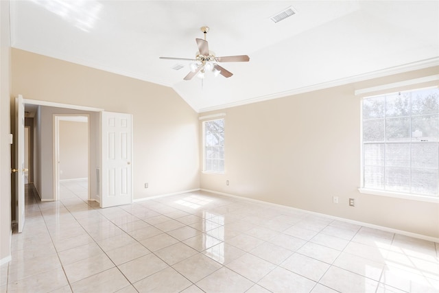 unfurnished room with ornamental molding, ceiling fan, light tile patterned flooring, and lofted ceiling