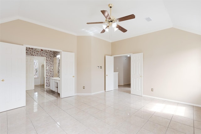 unfurnished bedroom with ceiling fan, light tile patterned floors, crown molding, and lofted ceiling