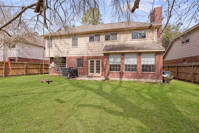 back of house with french doors, a patio, cooling unit, and a lawn