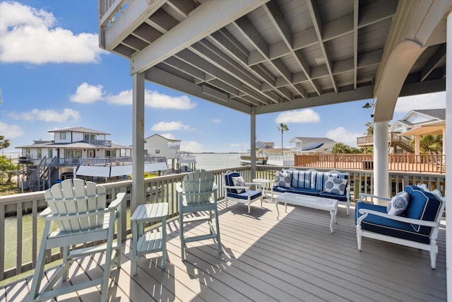 wooden terrace with outdoor lounge area and a residential view