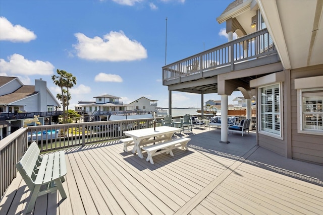 wooden terrace featuring outdoor dining space