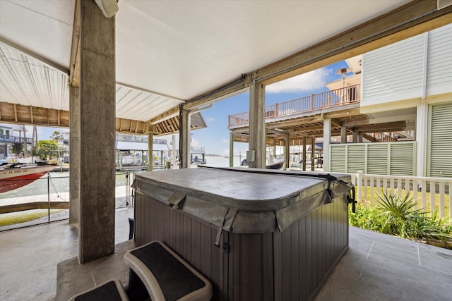 view of patio / terrace with a hot tub