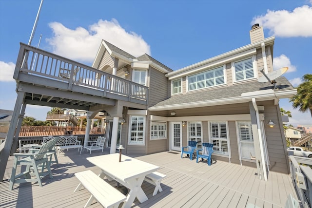 wooden deck with outdoor dining area