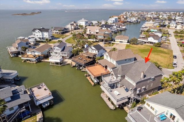 bird's eye view featuring a water view and a residential view